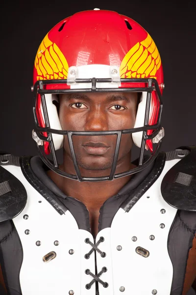 Football Player with American Football Shoulder and helmet — Stock Photo, Image