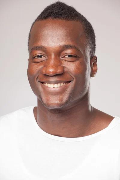 Close up Portrait of a african man on gray background — Stock Photo, Image