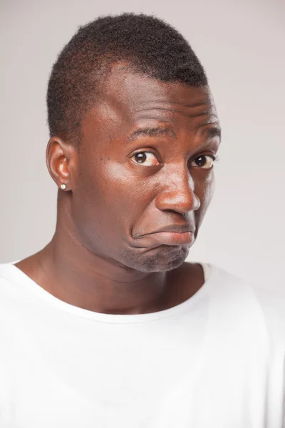 Close up Portrait of a african man on gray background — Stock Photo, Image