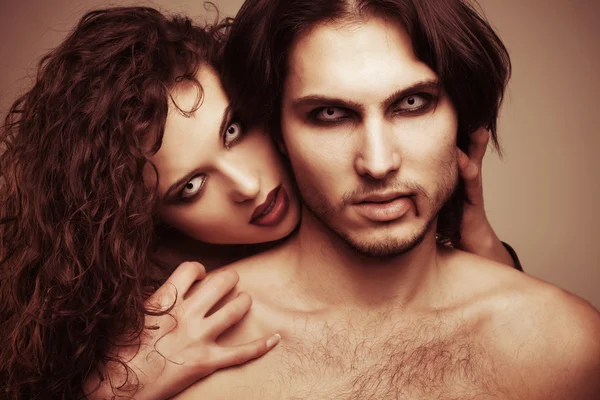 Glamorous portrait of a pair of vampire lovers — Stock Photo, Image