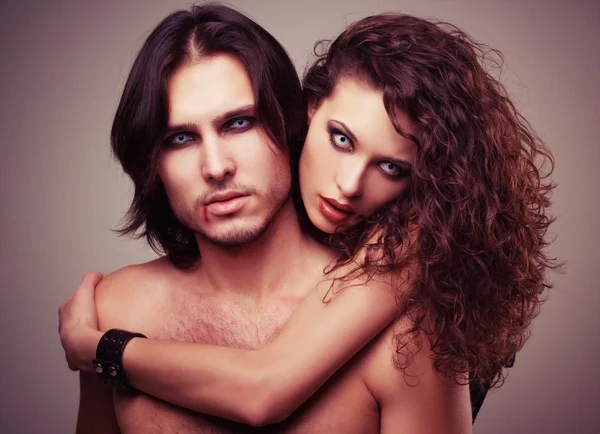 Glamorous portrait of a pair of vampire lovers — Stock Photo, Image