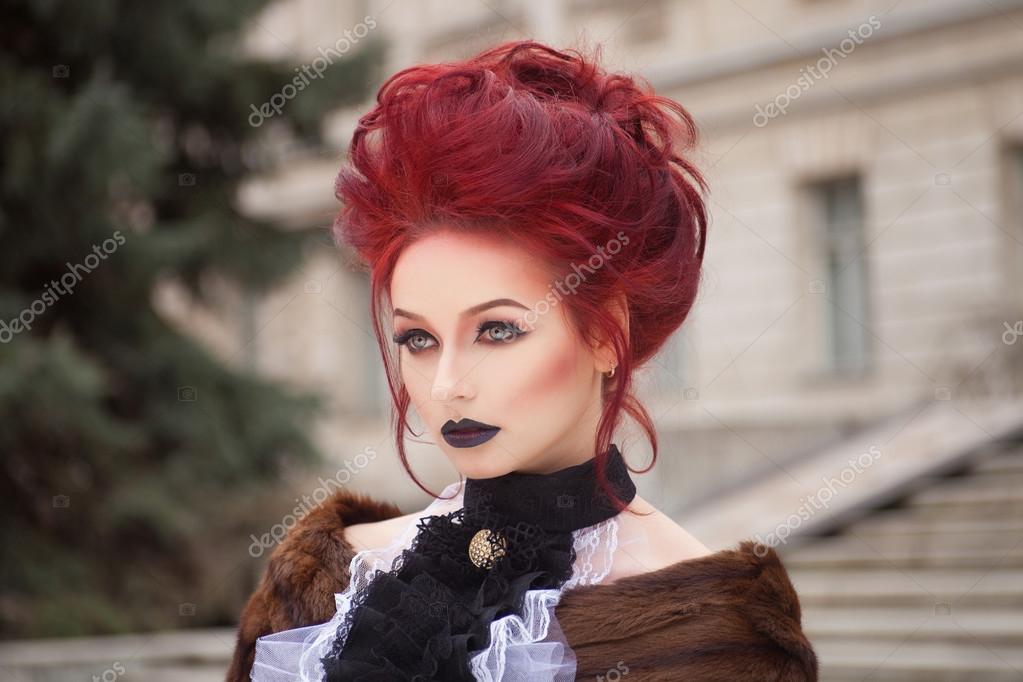 Sexy woman with gothic makeup and red hair and castle Stock Photo by  ©margo_black 66869515