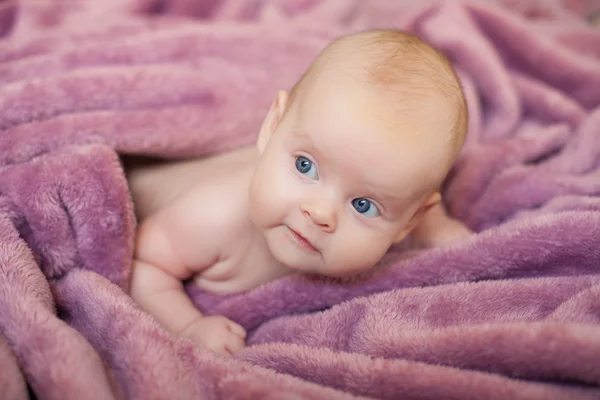 Beautiful baby girl in the crib, three months — Stock Photo, Image