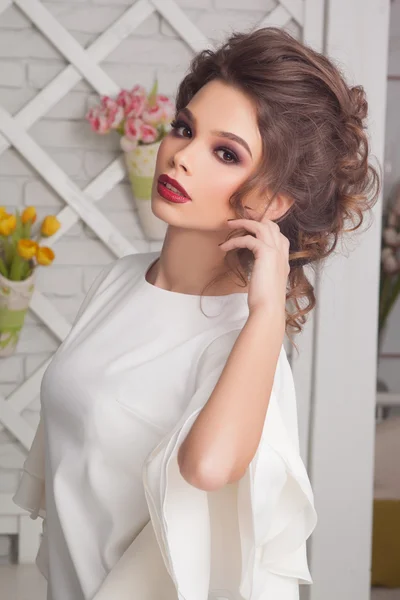 Fashionable attractive young woman in white dress in cafe in Provence style — Stock Photo, Image