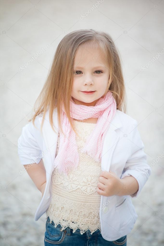 Beautiful baby girl with blonde hair outdoors. Little girl 2-3 year old  Stock Photo by ©margo_black 73552421