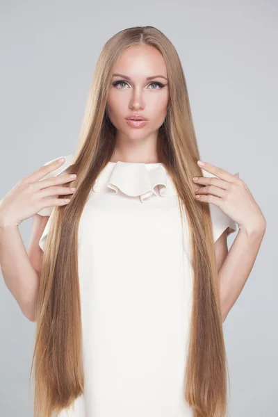 Beautiful hair, portrait of an young girl with short dress — Stock Photo, Image