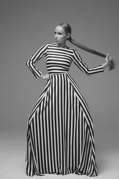 Portrait of an young girl with long fashion dress — Stock Photo, Image