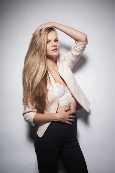 Gorgeous beautiful sexy woman in whiter jacket, studio shoot — Stock Photo, Image