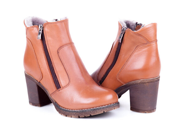 Stylish leather boots shot in studio, isolated on white