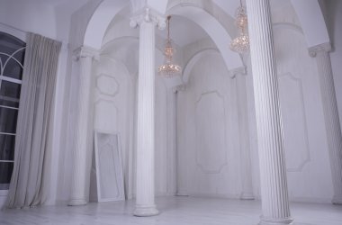 Beautiful white hall baroque with columns and with high ceilings