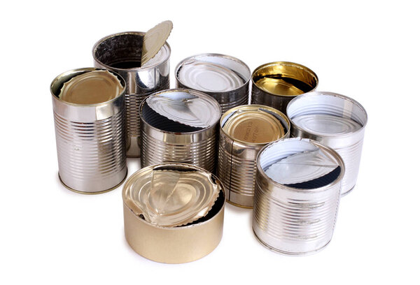 Heap of old empty cans on a white background. Isolated objects