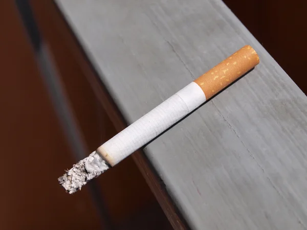 Filter cigarettes on wall Stock Picture