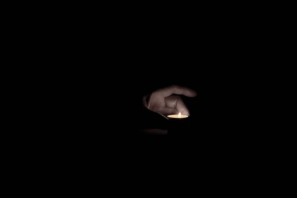 Human Hand Wants Take Burning Candle Dark — Stock Photo, Image