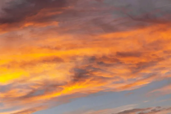 Beautiful stormy sunset sky.Beautiful clouds with light of sunset in blue sky