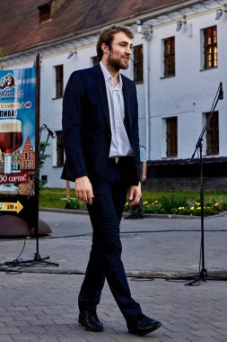 May 25, 2019 Minsk Belarus A handsome French actor with a beard stands at a street concert