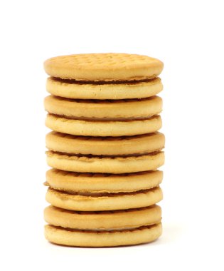 pilas de galletas sobre fondo blanco