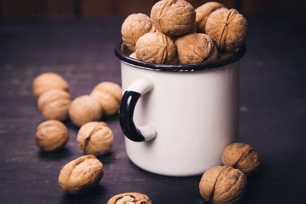 Walnut with white cup — Stock Photo, Image