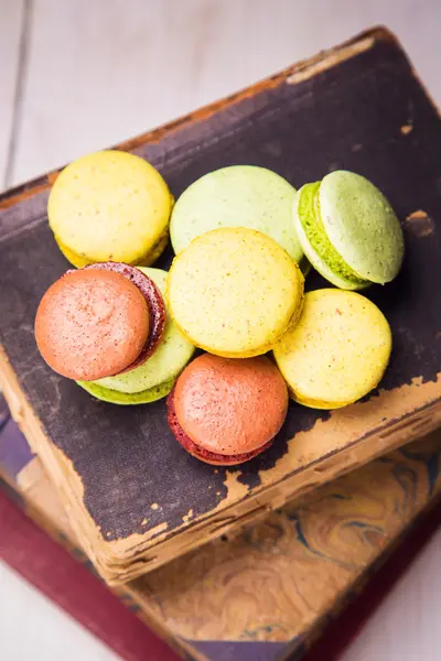 Macaroons on book — Stock Photo, Image