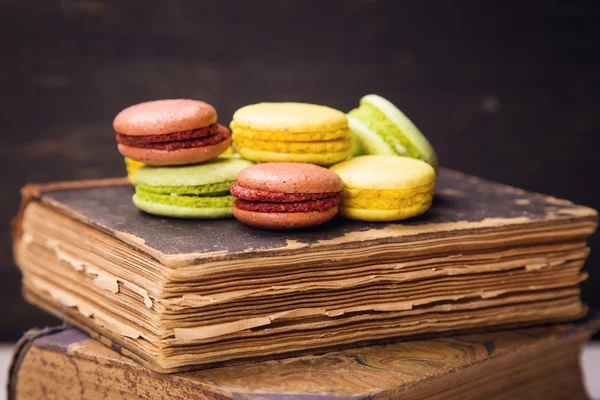 Macaroons on book — Stock Photo, Image