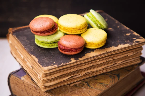 Macaroons on book — Stock Photo, Image