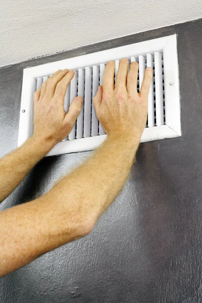 Hands on an Air Vent — Stock Photo, Image