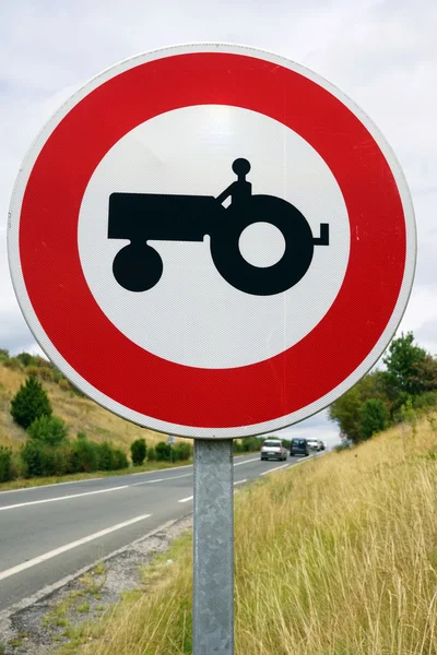 Red sign with tractor on the road in France — Stock Photo, Image