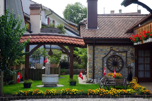 Inner yard of traditional Swiss house in the village — Stock Photo, Image