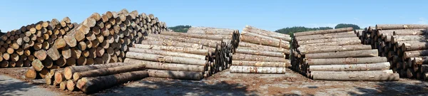 Timber heaps near factory — Stock Photo, Image