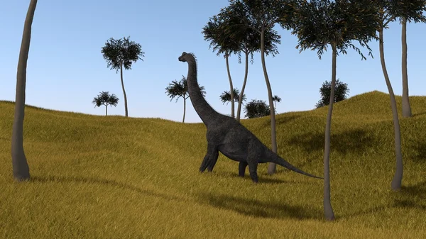 草で覆われた丘の上のブラキオサウルス — ストック写真