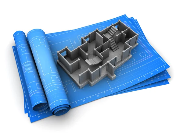 Rolled blueprints and concrete building model — Stock Photo, Image