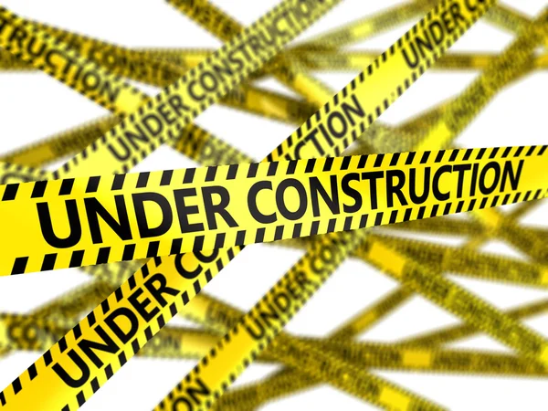 Yellow tape with under construction sign — Stock Photo, Image