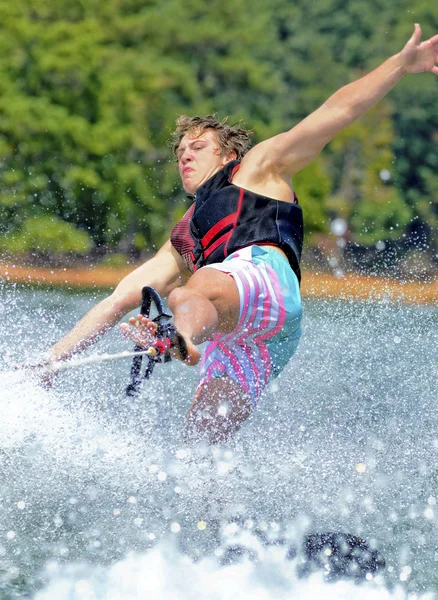 Teenage Boy Holding Rope with Foot  While Trick Skiing — Stock Photo, Image