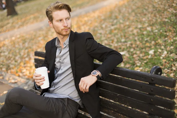 Young man drinking coffee — Stock Photo, Image