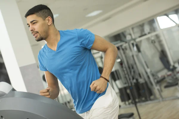 Young man in the gym — Stock Photo, Image