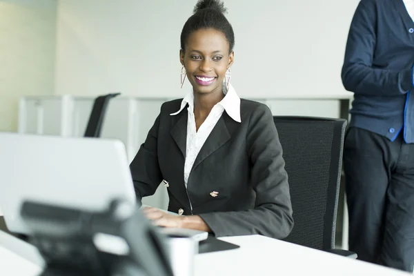 Young woman in the office — Stock Photo, Image