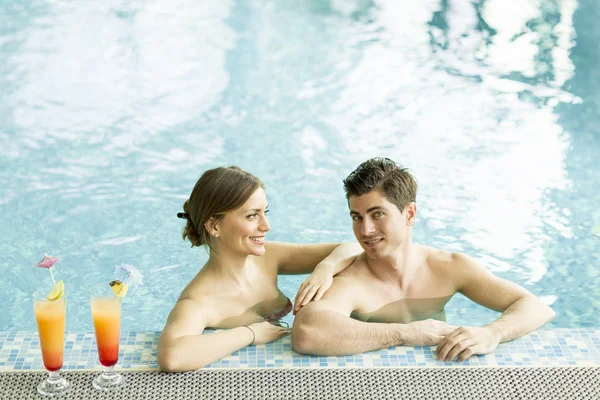 Young couple in the pool — Stock Photo, Image