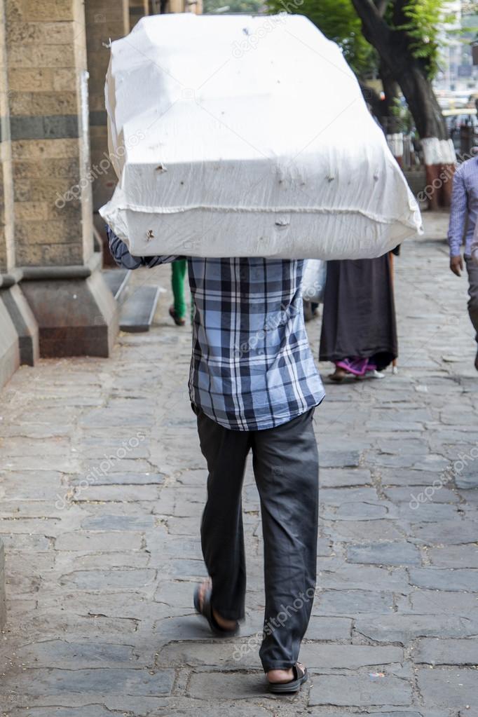 Man carrying weight Stock Editorial Photo © boggy22 109594374