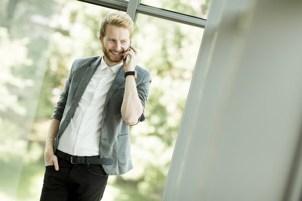 Redhair businessman on the phone