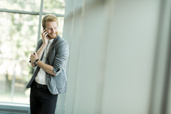 Redhair businessman on the phone