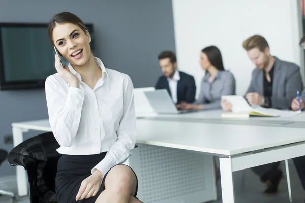 Young woman on the phone — Stock Photo, Image