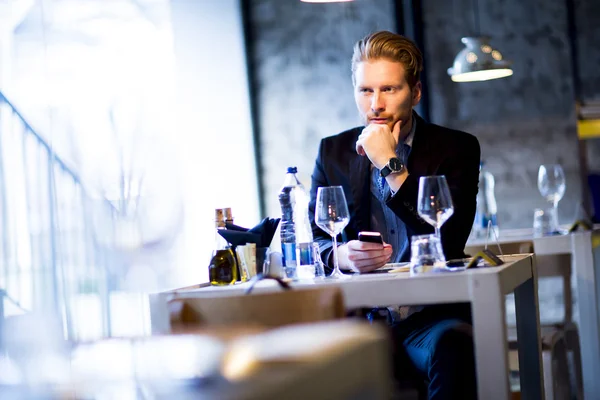 Young man in restaurant — Stock Photo, Image