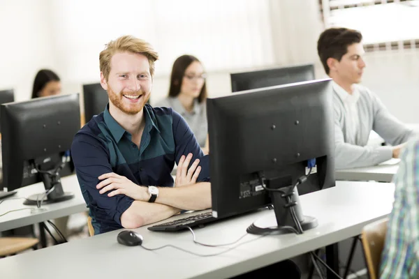 Young people in the classroom — Stock Photo, Image