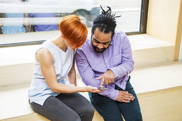 Multiracial couple using smartphone