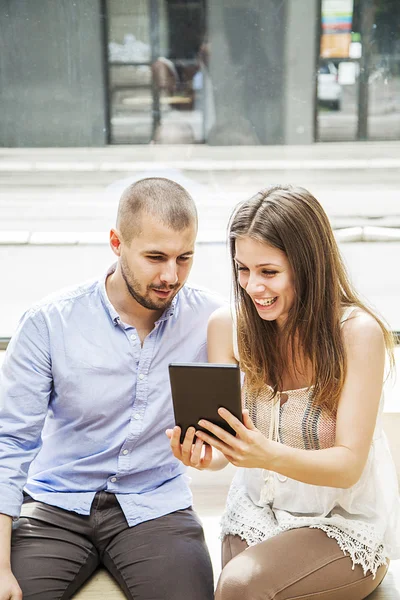 Young couple with tablet — Stock Photo, Image