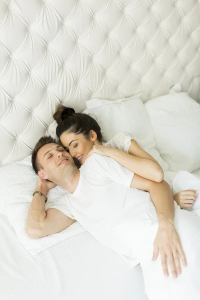 Young couple in bed — Stock Photo, Image