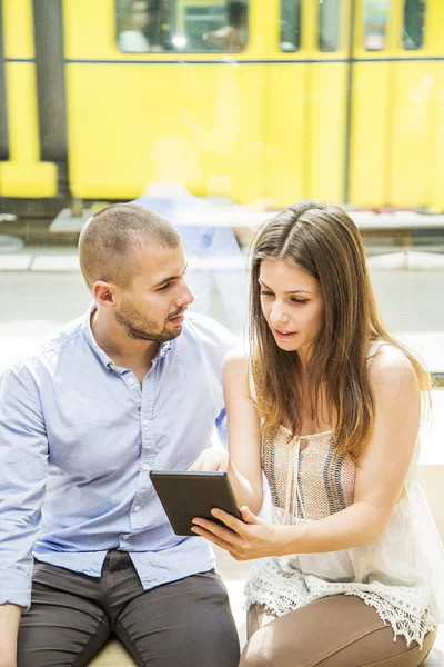 Young couple with tablet — Stock Photo, Image