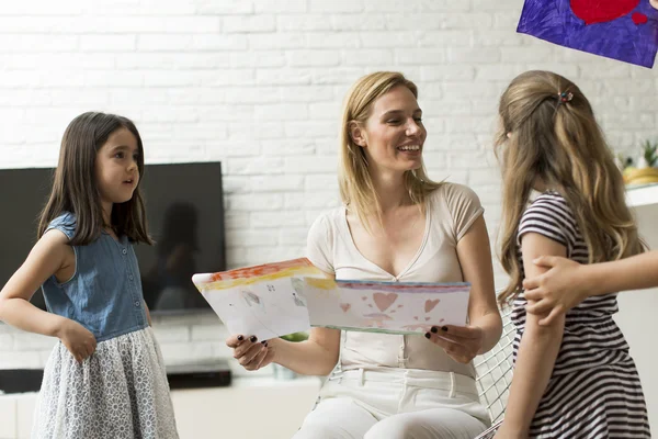 Mother with daughters at home — Stock Photo, Image