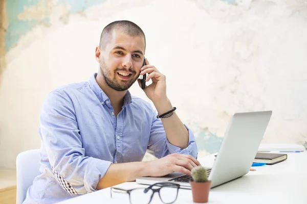 Young man in the office — Stock Photo, Image