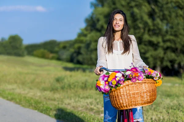 Young girl rides a bicycle — Stock Photo, Image