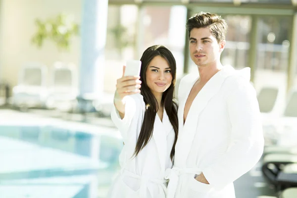 Young couple by the pool — Stock Photo, Image